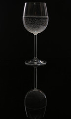 pure glass of water and reflection of the glass