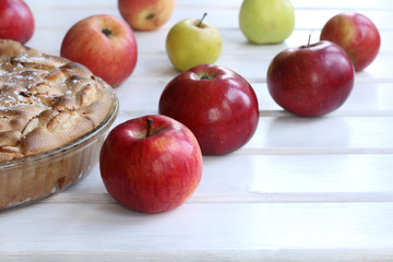 sweet pastries and fresh fruit/ cooked pie with golden brown and apples are different 