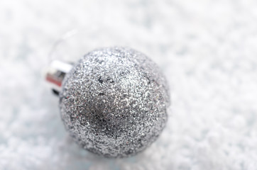 Christmas background with a gray ball and snowflakes