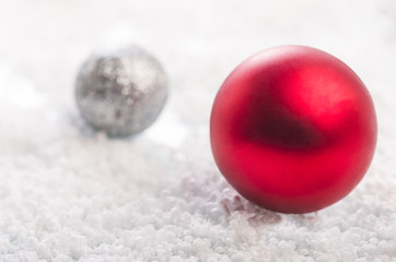 Christmas background with a red, gray balls and snowflakes