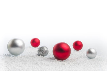 Christmas background with a red, gray balls and snowflakes