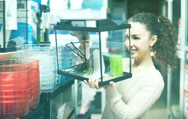 Female customer buying new terrarium or aquarium