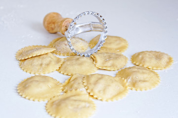 Ravioli on white background. Raw product with stamp. - 121657838