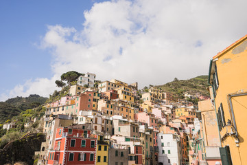 Fototapeta na wymiar View of riomaggiore village and blue sky and cloud situated is valley of La Spezia , Italy