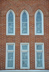 Old church windows in brick wall