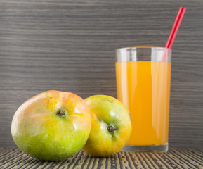 Mango juice on wooden background