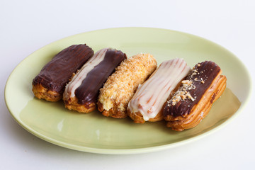 eclairs different species on a plate