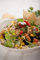 Homemade fresh organic chicken chipotle black bean salad bowl macro shot