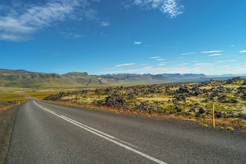 Fototapeta na wymiar Isolated road and Icelandic colorful landscape at Iceland, summe