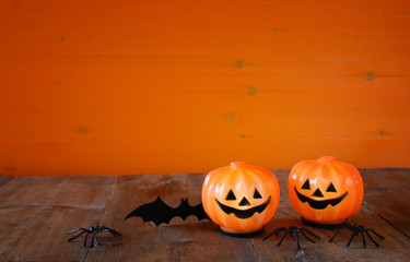 Halloween holiday concept. Cute pumpkins, spiders and bat