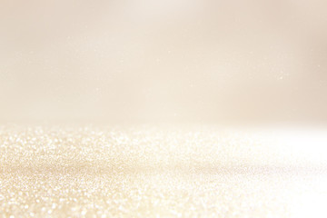 glitter vintage lights background. silver and gold. de-focused.