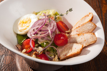 chicken breast salad with cherry tomatoes and egg