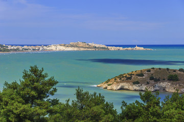 Naklejka na ściany i meble Gargano coast: bay of Vieste.-(Apulia) ITALY-In the foreground the island Gattarella and in the background the town of Vieste.