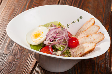 chicken breast salad with cherry tomatoes and egg