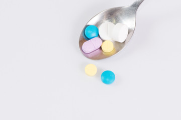 The medicines and spoon  isolated on a white background, clipping path