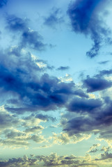 Fototapeta na wymiar Beautiful blue sky with cumulus clouds at sunset. HDR photo