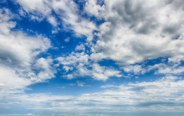 Fototapeta na wymiar Bright blue sky with cumulus white clouds. HDR photo