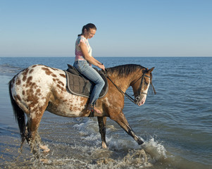 woman and appaloosa horse