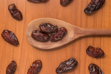 Dried Dates into a spoon. Tamara