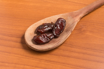 Dried Dates into a spoon. Tamara