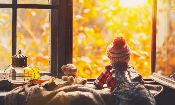 Child Girl Looking Through Open Window At Nature Autumn