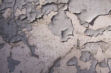 White peeling paint on a wall