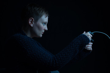 female gamer with wired controller