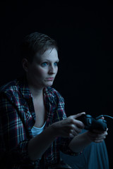 female gamer with wired controller