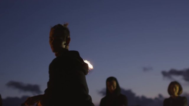 Male Artist Performing Fire Show Outdoors at Evening Time. Shot on RED Cinema Camera in 4K (UHD).