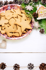 Christmas concept. Frame with a gingerbread, cones, fir-tree bra