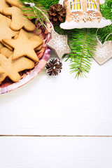 Christmas concept. Frame with a gingerbread, cones, fir-tree bra