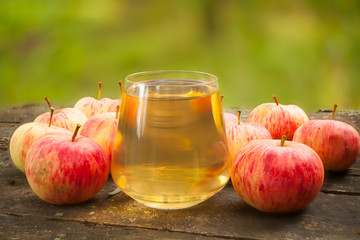 Delicious fresh squeezed apple juice in  transparent glass