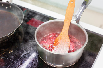 Pot with sauce