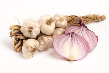 bunch of garlic and red sliced onion on white