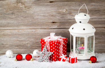 Christmas balls with snow on wooden