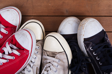 Old canvas shoes on a wooden floor