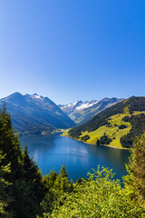 Obraz na płótnie Canvas Summer sunny scene in the valley of Speicher Durlassboden lake in the Austrian Alps. View from Gerlos pass, Austria, Europe.