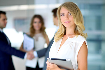 Blonde businesswoman looking at camera