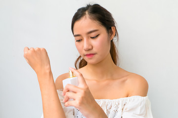 The Girl with perfume, young beautiful woman holding bottle of p