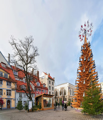 Wooden Christmas tree and people in Riga Old city