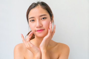 The Portrait of a beautiful female model on white background