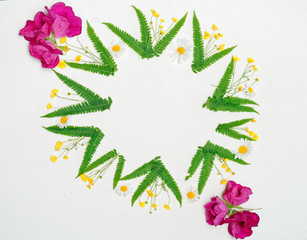 Wreath of chamomile, ranunculus and fern and tea roses