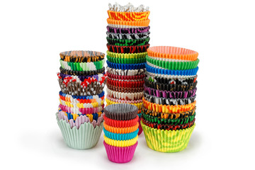 Bright multicolored Paper cupcake holders isolated on white