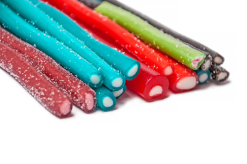 Sweet jelly licorice candy sticks with different flavor, isolated on white background