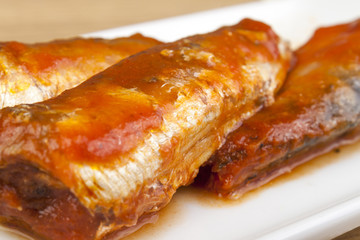 Close up of sardines in tomato sauce