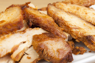 Close up of slices of barbecued chicken