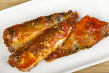 Plated sardines in a rich tomato sauce