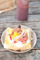 Egg in a hole is breakfast menu eat with tomato sauce