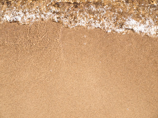 Fototapeta na wymiar light wave on the sandy beach