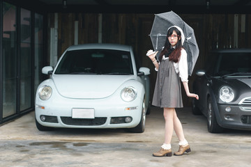 Naklejka premium Asian girl with umbrella